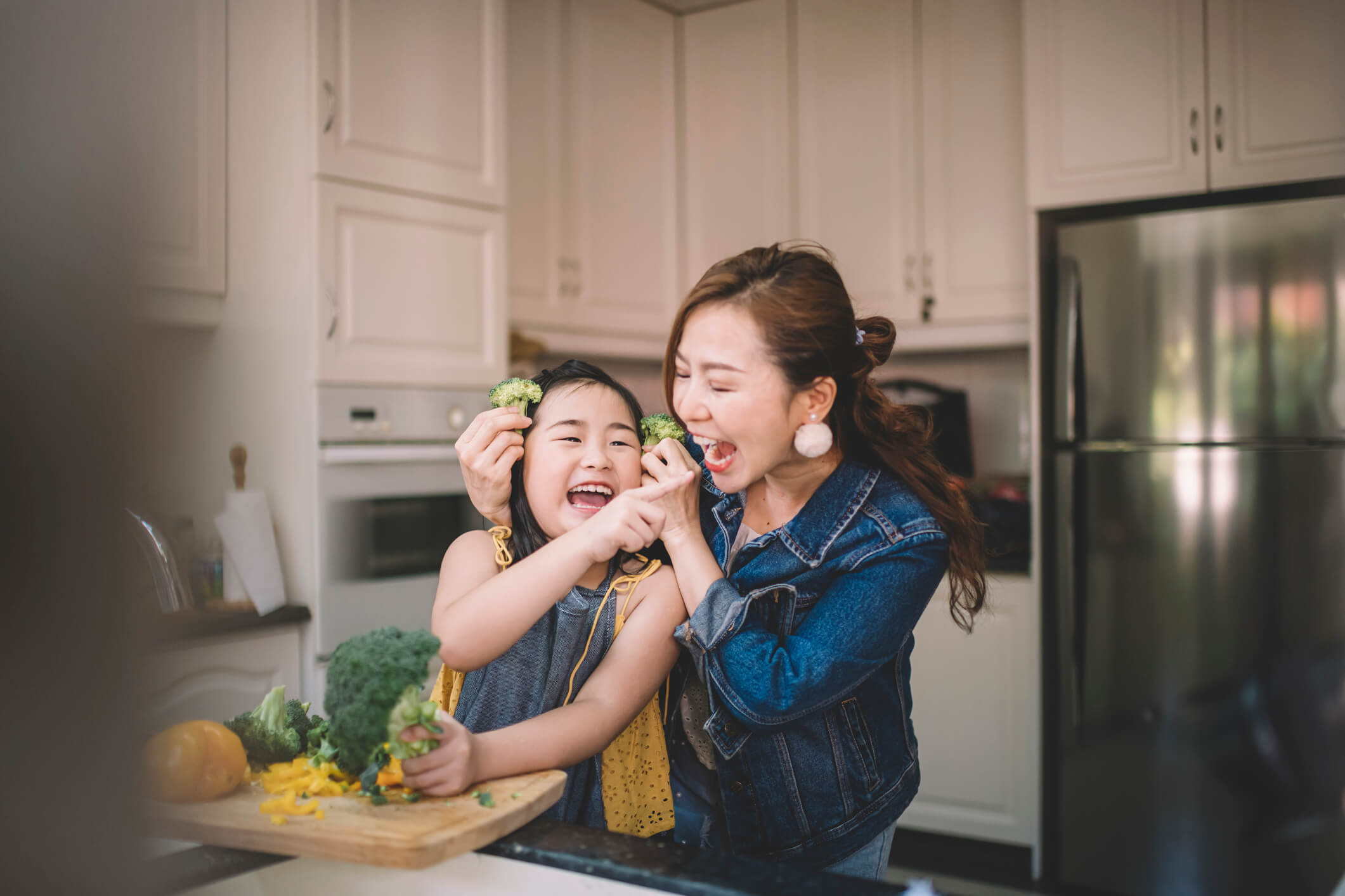 mom and daughter cooking