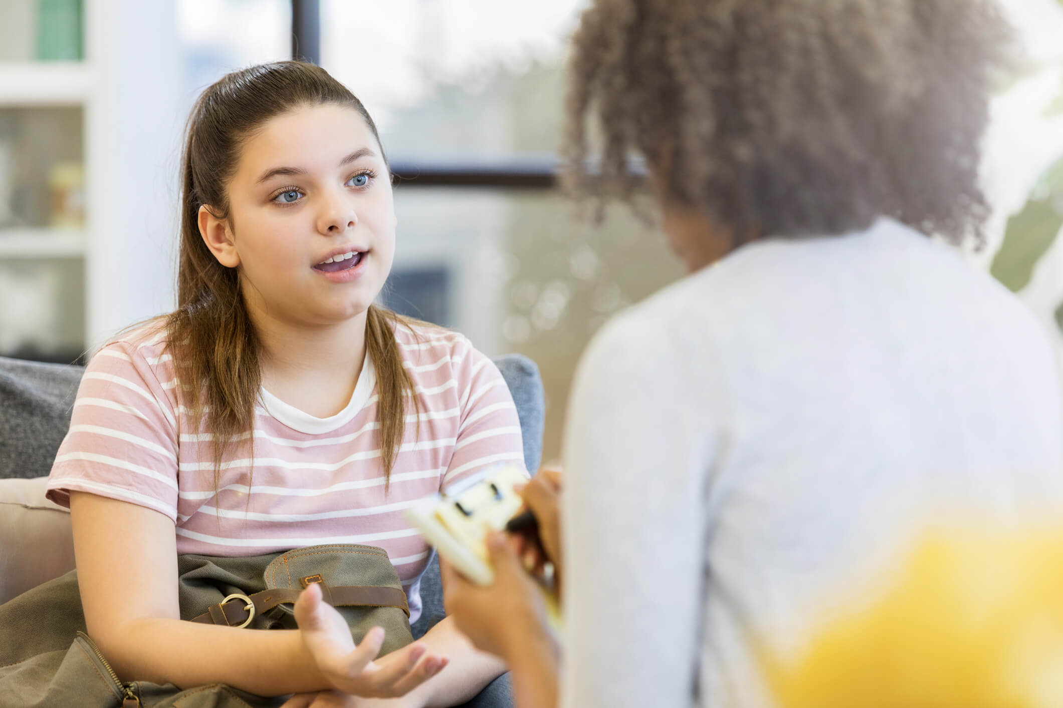 girl talks to counselor
