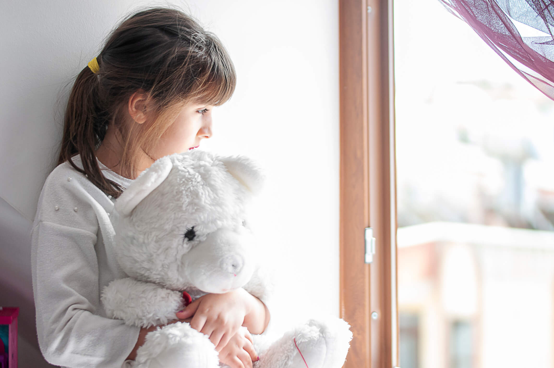Girl holding bear